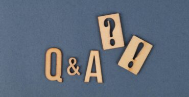 Wooden Letters and Wooden Punctuation Marks on Gray Surface