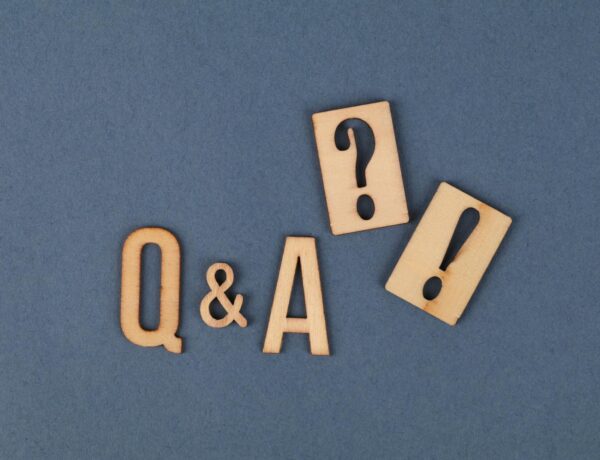 Wooden Letters and Wooden Punctuation Marks on Gray Surface