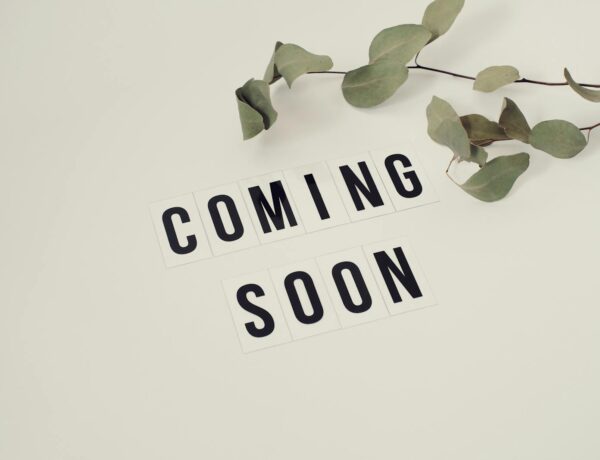 Eucalyptus branch with 'Coming Soon' message on white background for announcements.